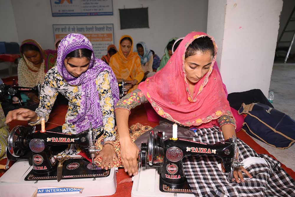 Women working together in a sewing center